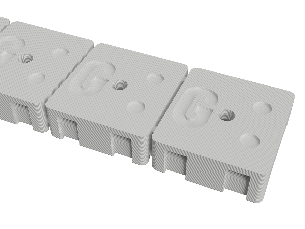 Underside of the 1-1/8 inch hose mount strip showing the adhesive pockets