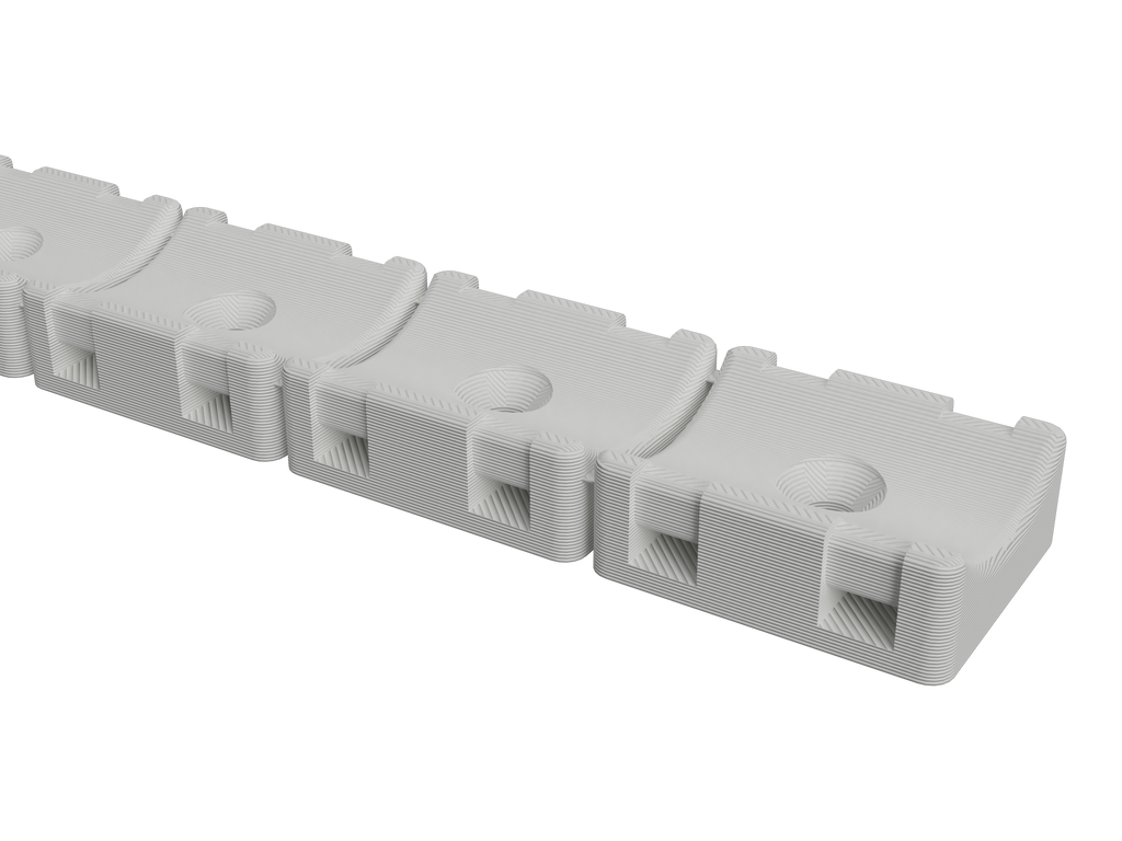 Close-up of the 3/4 inch hose mount strip showing the hose cradles and zip-tie slots