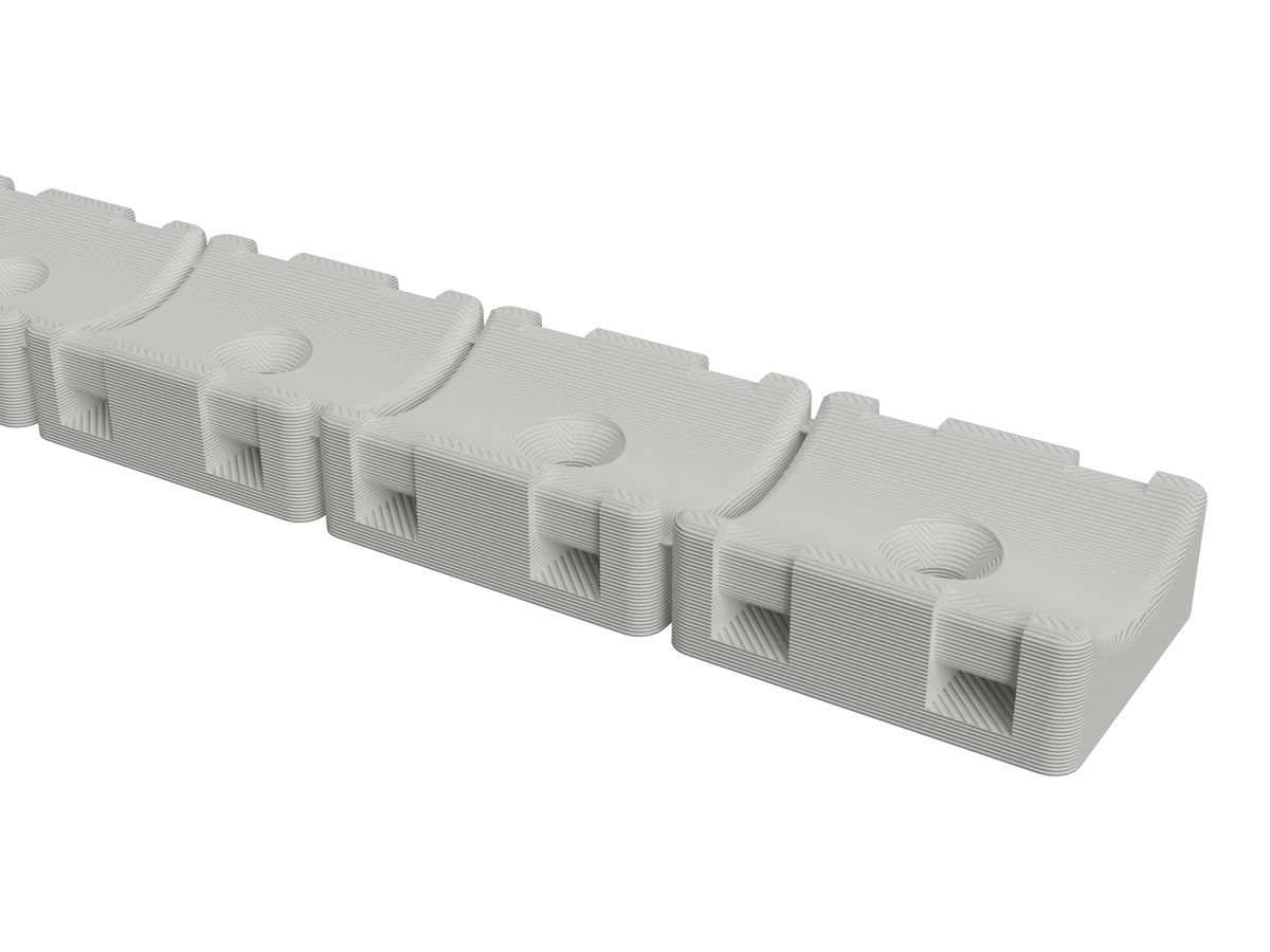Close-up of the 3/4 inch hose mount strip showing the hose cradles and zip-tie slots