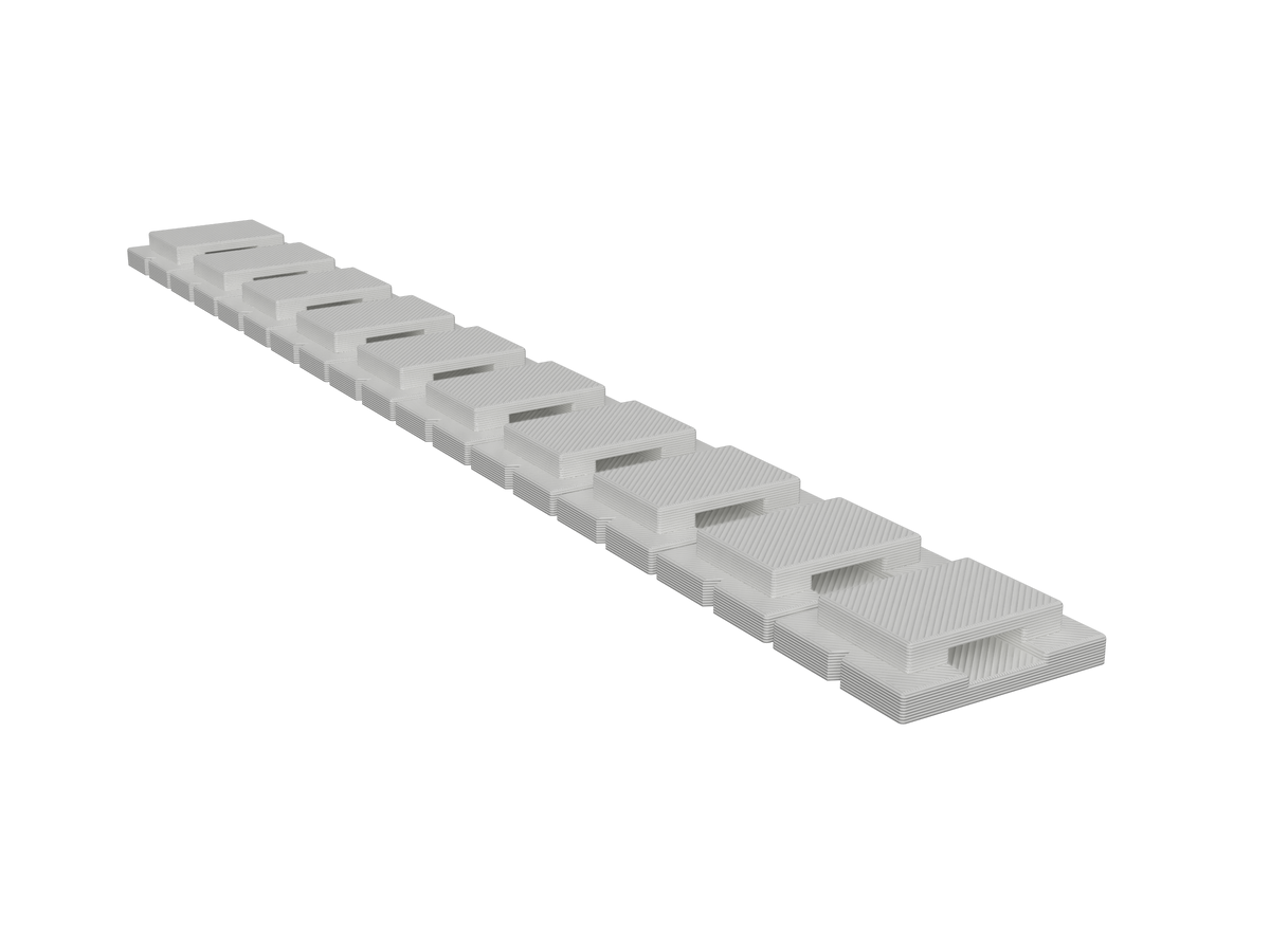Strip of 10 white zip-tie anchors, angled view